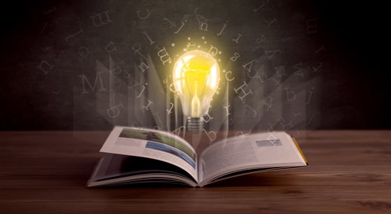 Storytelling in content marketing illustrated with a lightbulb above an open book symbolizing creative ideas.